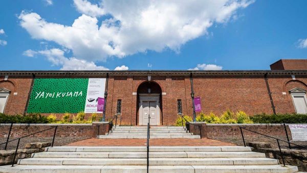 The outside of a museum under blue skies.