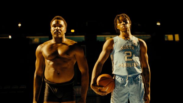 Dancer Michael Jackson Jr. stands alongside Carolina basketball player Caleb Love.