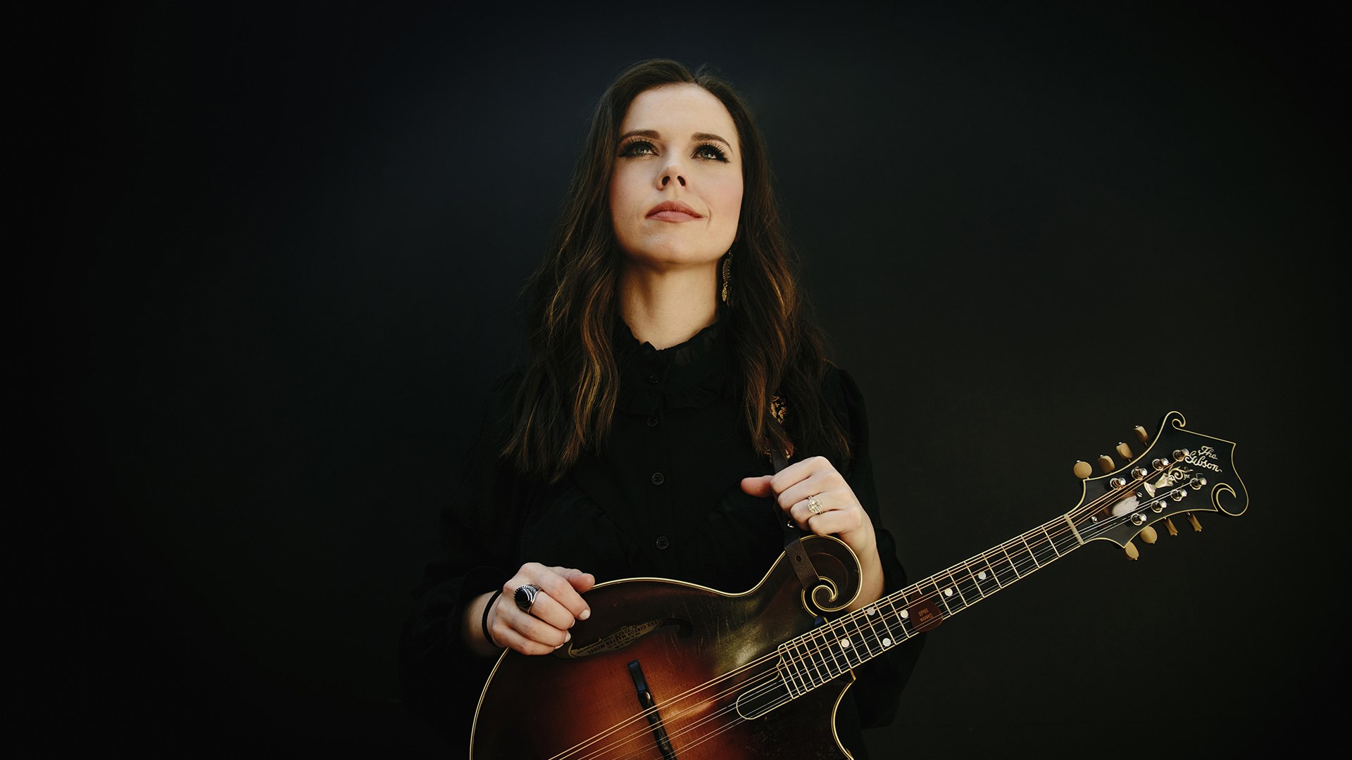 Sierra Hull with a Mandolin in hand.